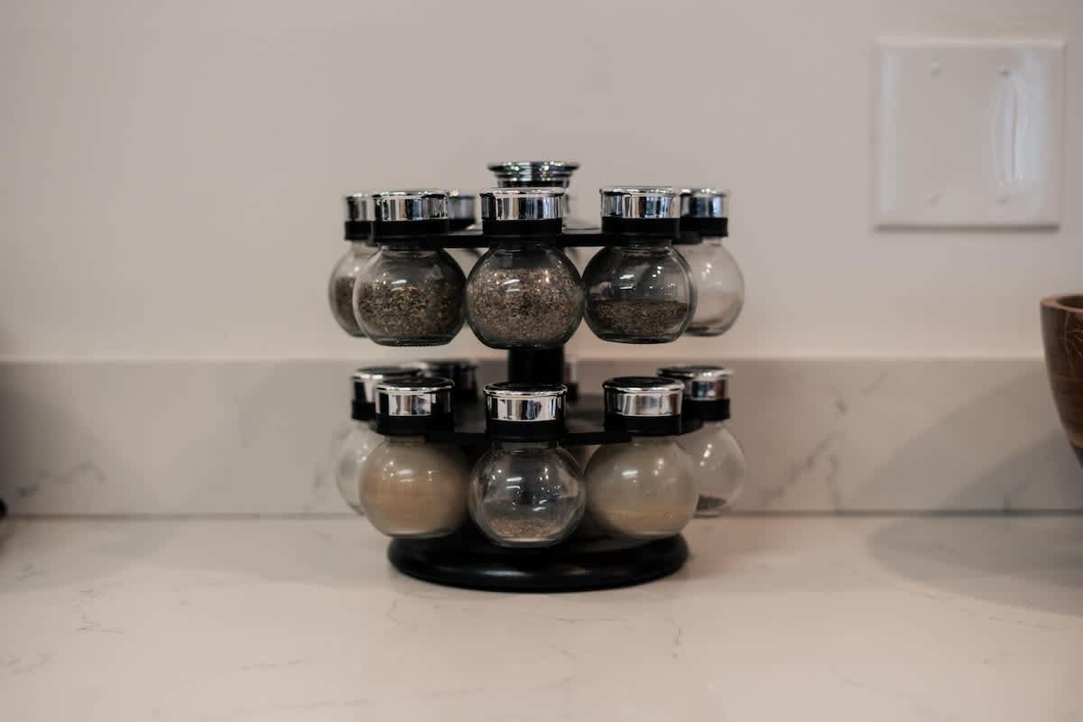 Spice rack in a Truckee vacation rental kitchen with marble countertop and sleek, modern design.