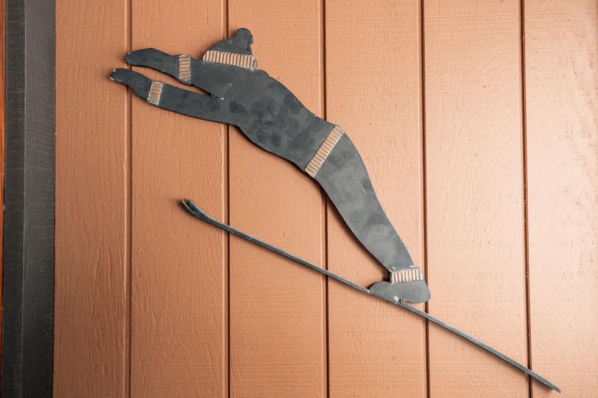 Wall sculpture of a skier in a Truckee vacation rental.