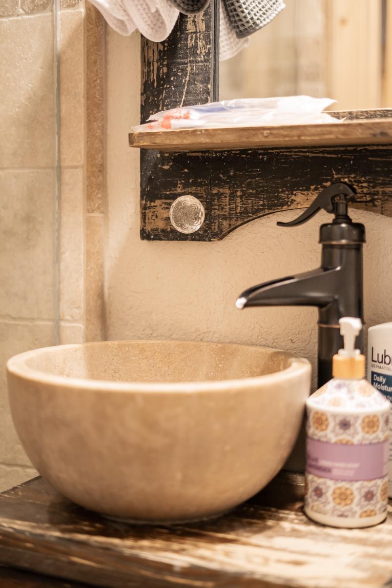 Rustic bathroom sink and faucet detail in a Truckee vacation rental.