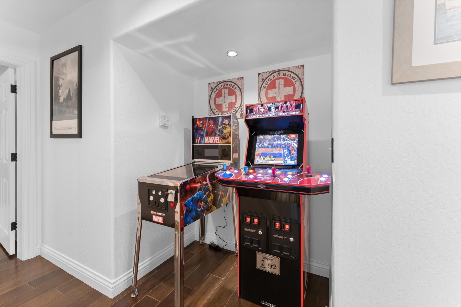 Arcade games in a Truckee vacation rental with NBA Jam and Marvel pinball machines in a cozy corner.