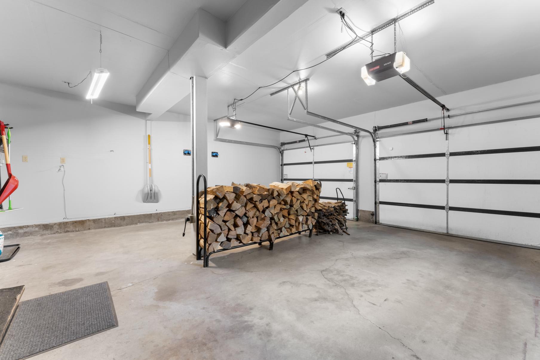 Garage interior in Truckee vacation rental with firewood neatly stacked by the wall.