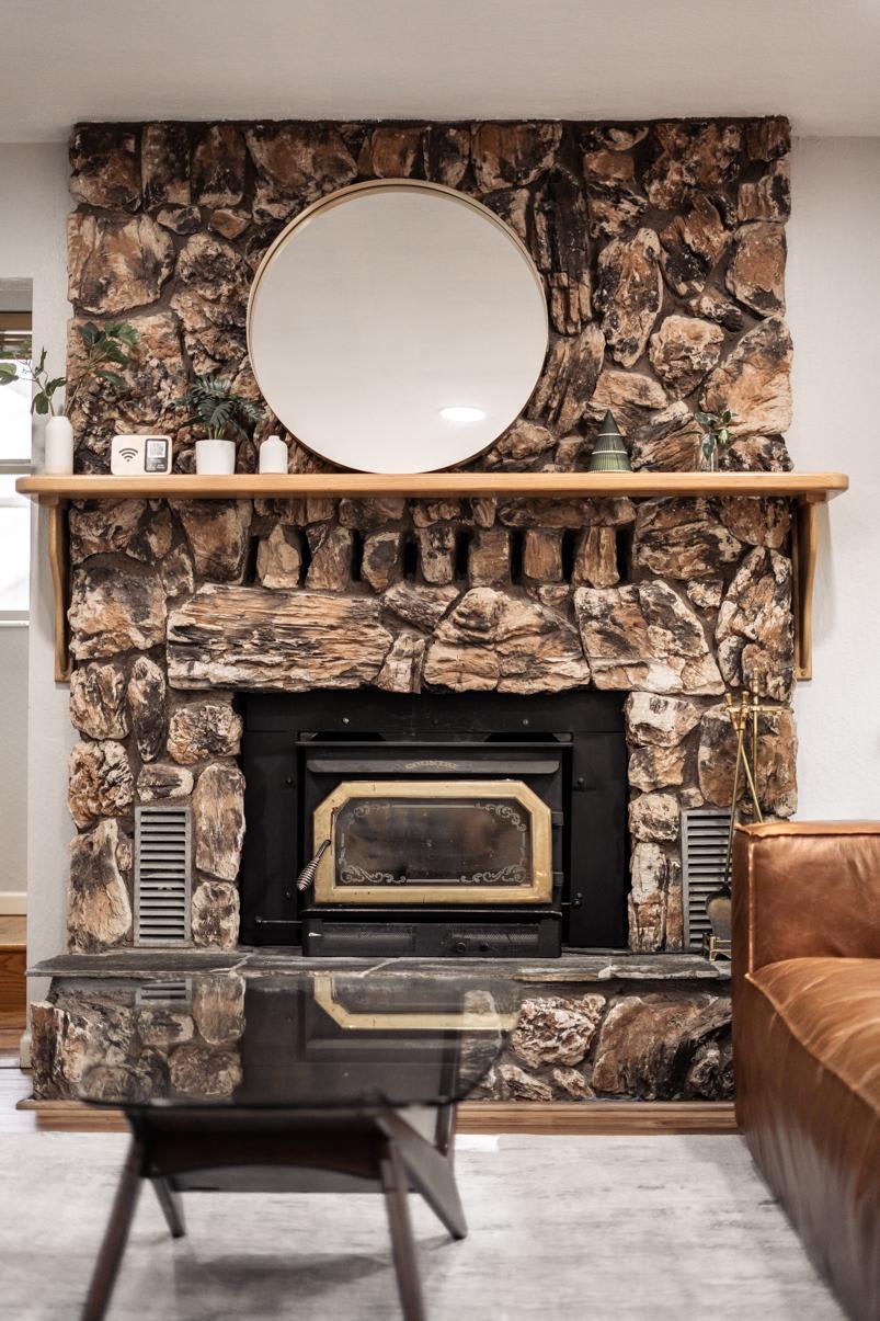 Cozy Truckee vacation rental with a stone fireplace and modern decor.