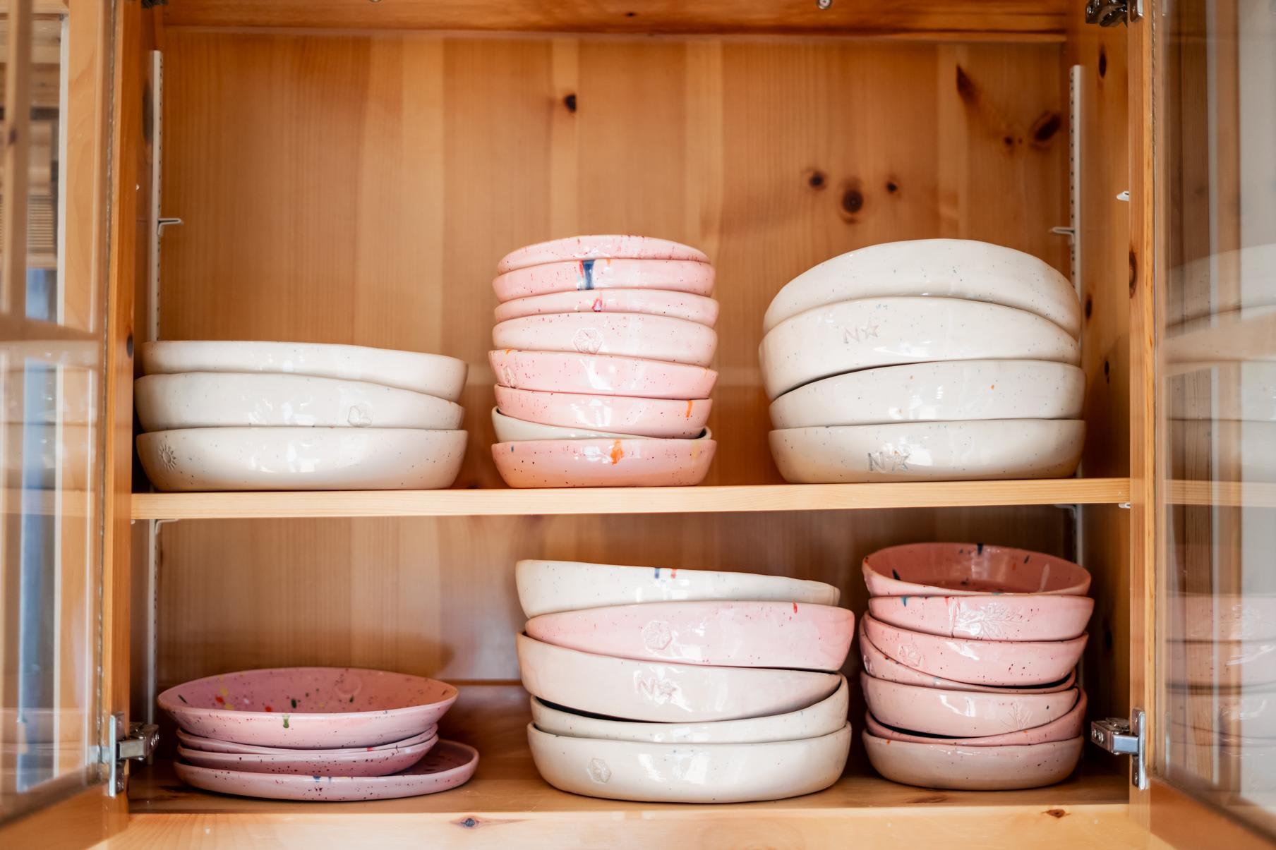 Cabinet with pastel dishes in a Truckee vacation rental kitchen.