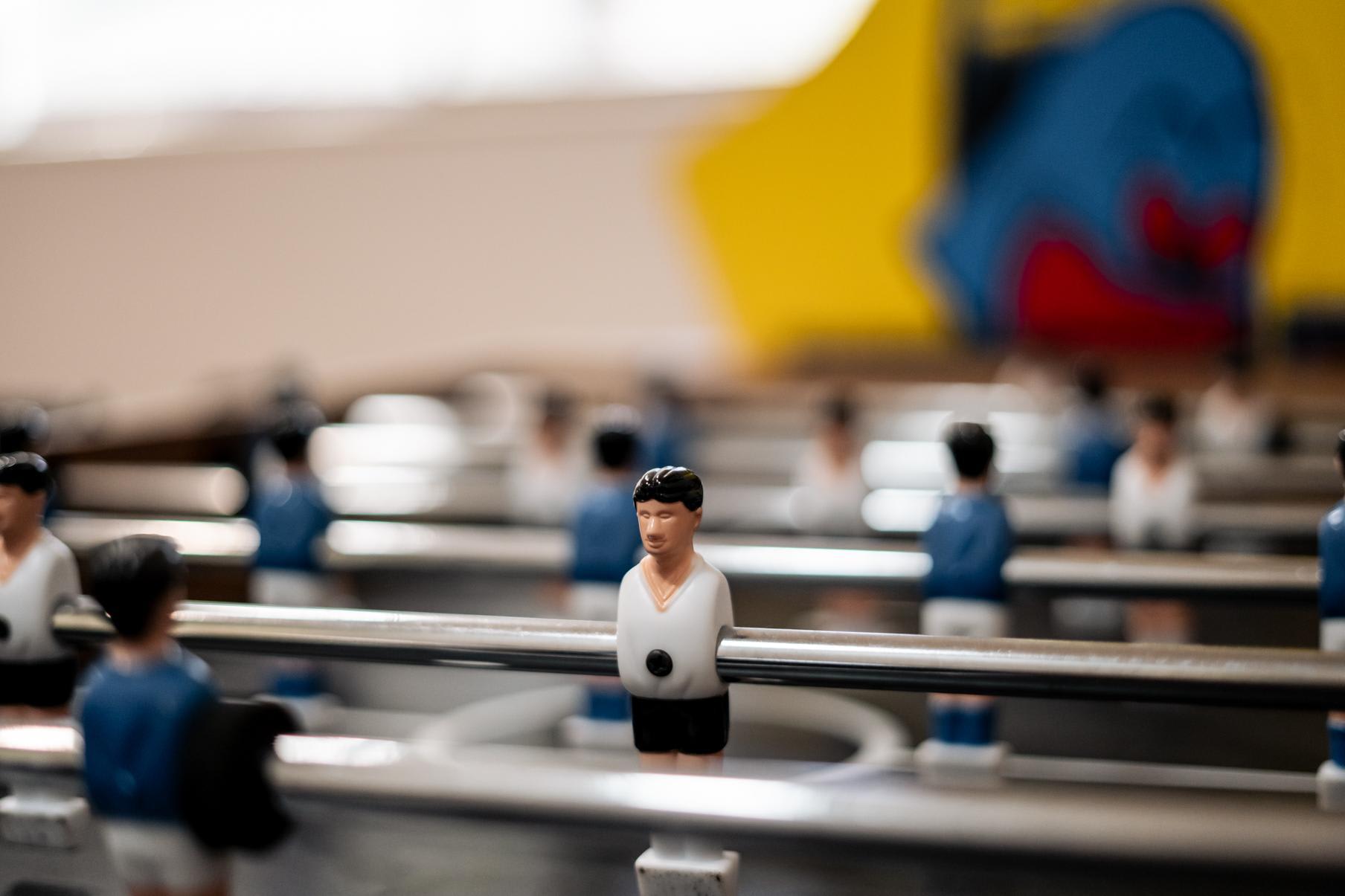 Foosball table inside a Truckee vacation rental with colorful wall art in the background.