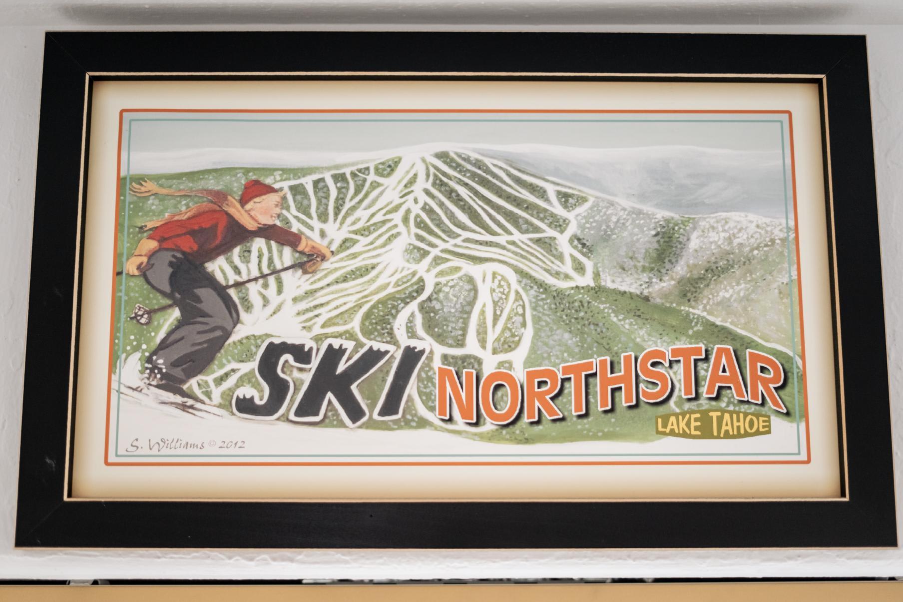 Framed poster of a skier with "Ski Northstar Lake Tahoe" text, suitable for a vacation rental in Truckee.