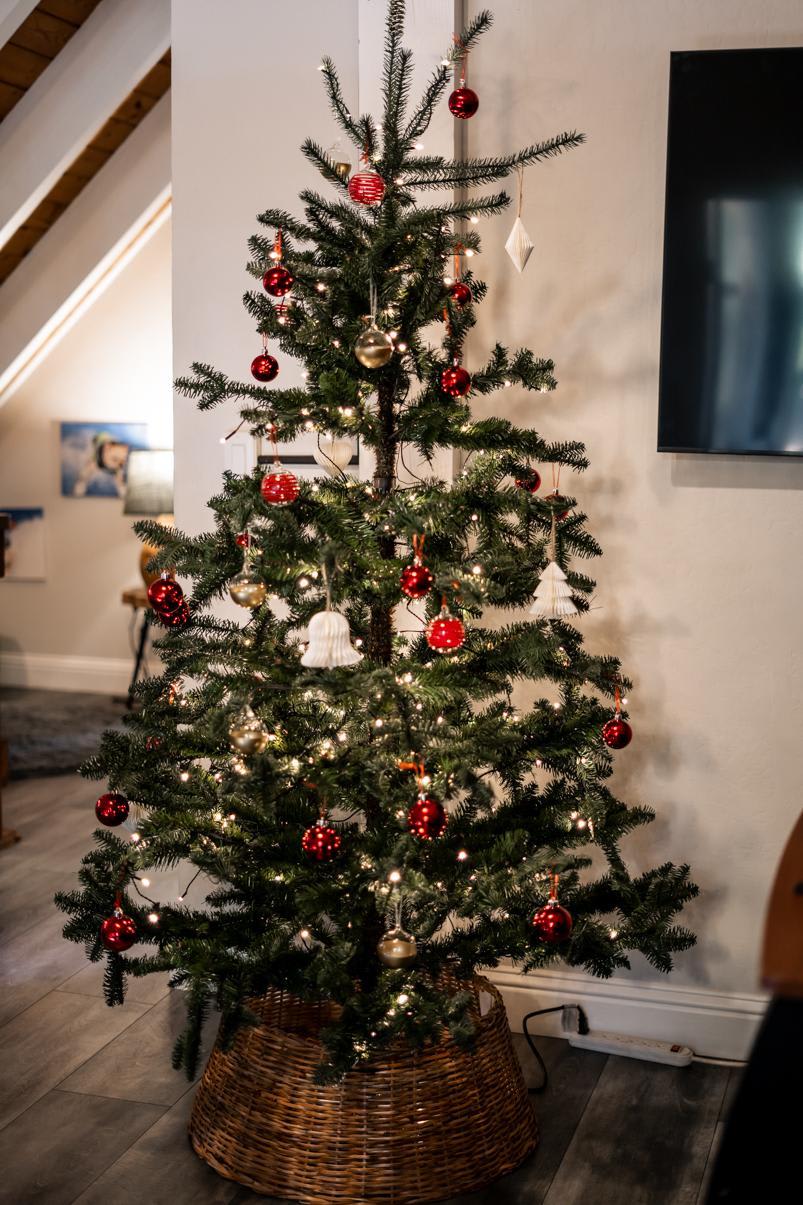 Decorated Christmas tree in a Tahoe Vista vacation rental living room with modern decor.