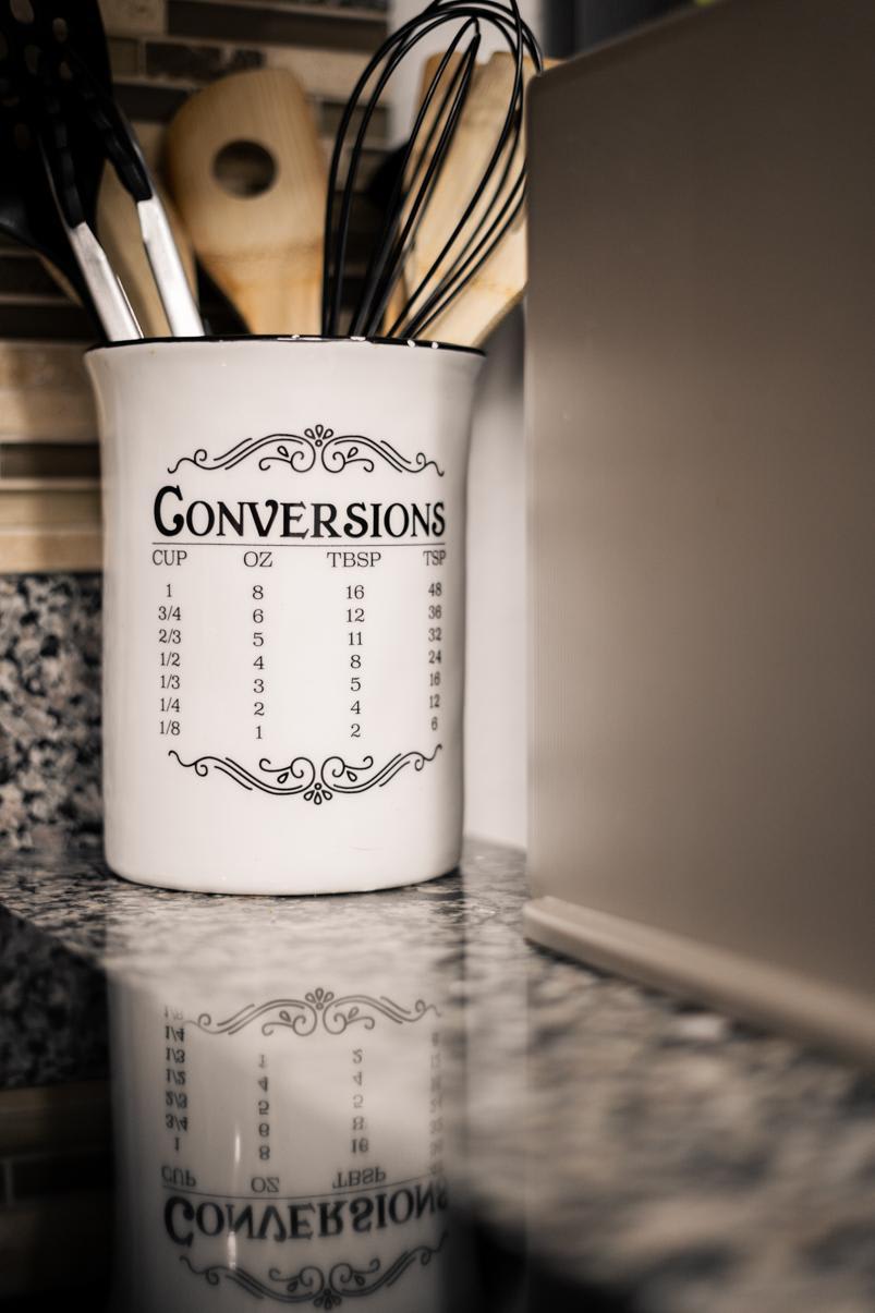 Kitchen counter with utensil holder and conversions chart in Truckee vacation rental.