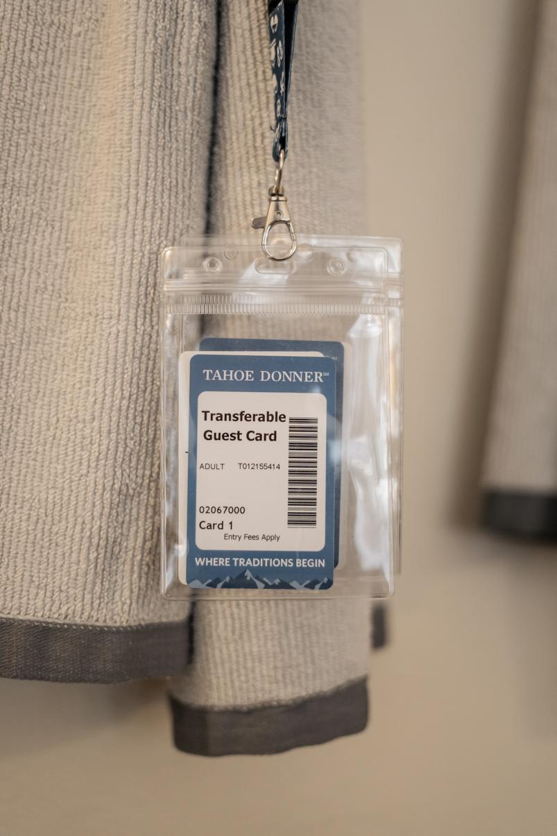 Guest card for a Truckee vacation rental hangs on a beige towel.