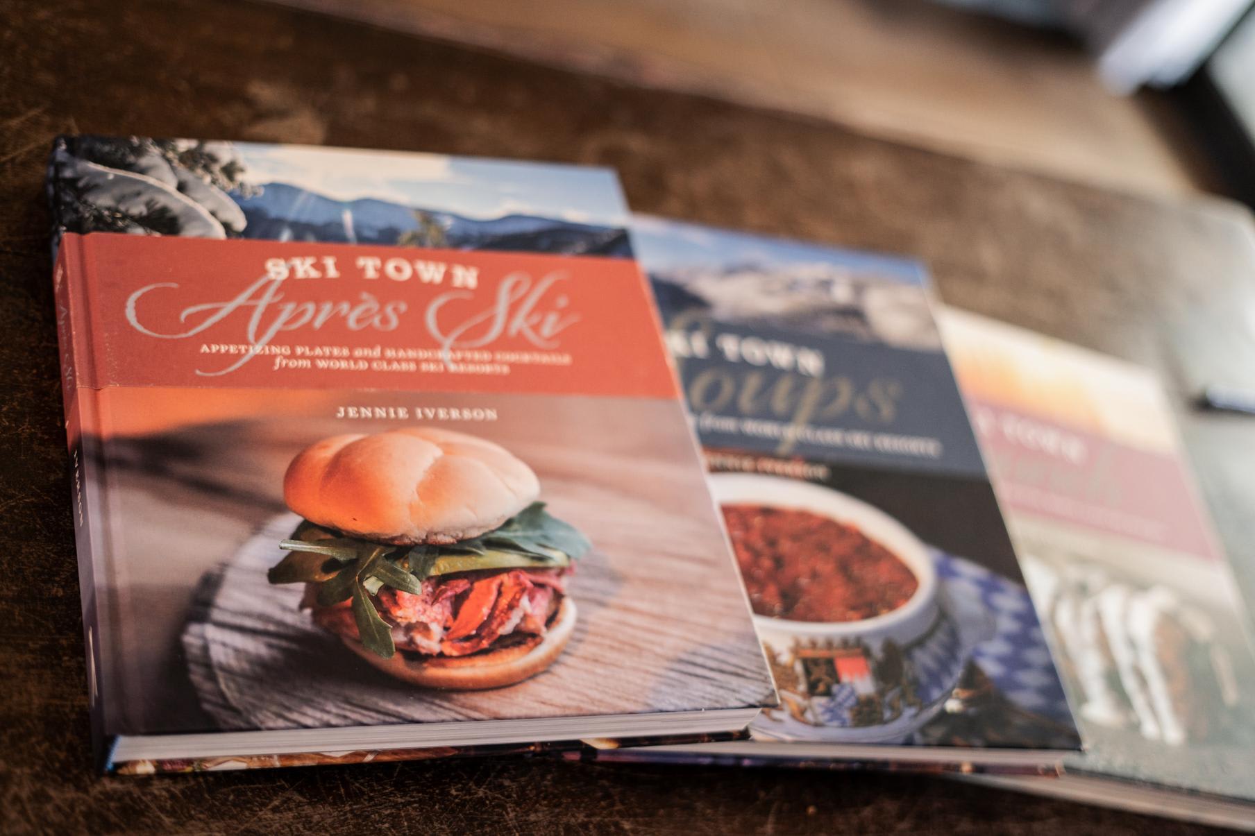 Cookbooks on a table in a Truckee vacation rental, featuring "Ski Town Après Ski."