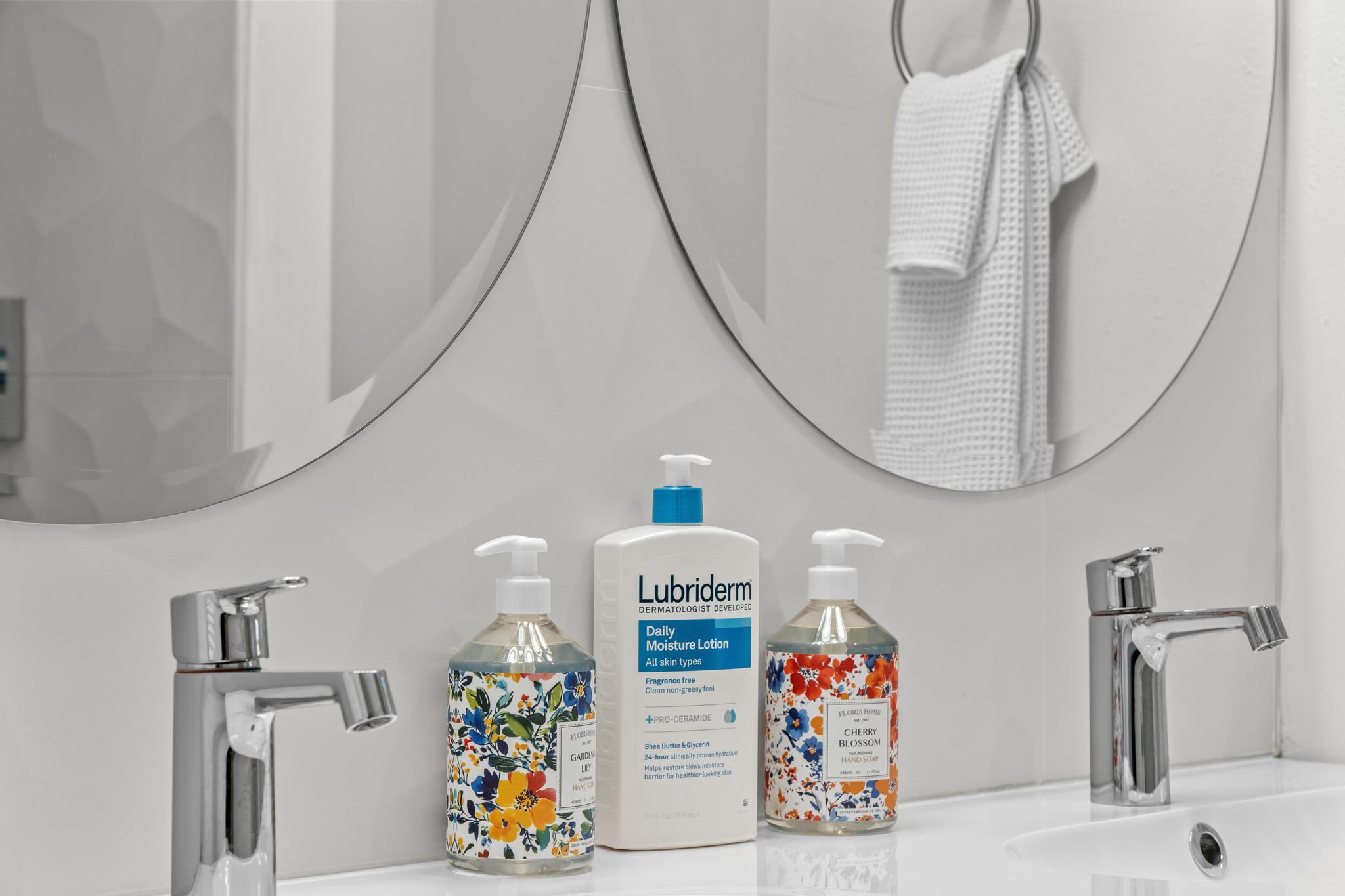 Bathroom countertop with soaps and lotion in a Tahoe Vista vacation rental.