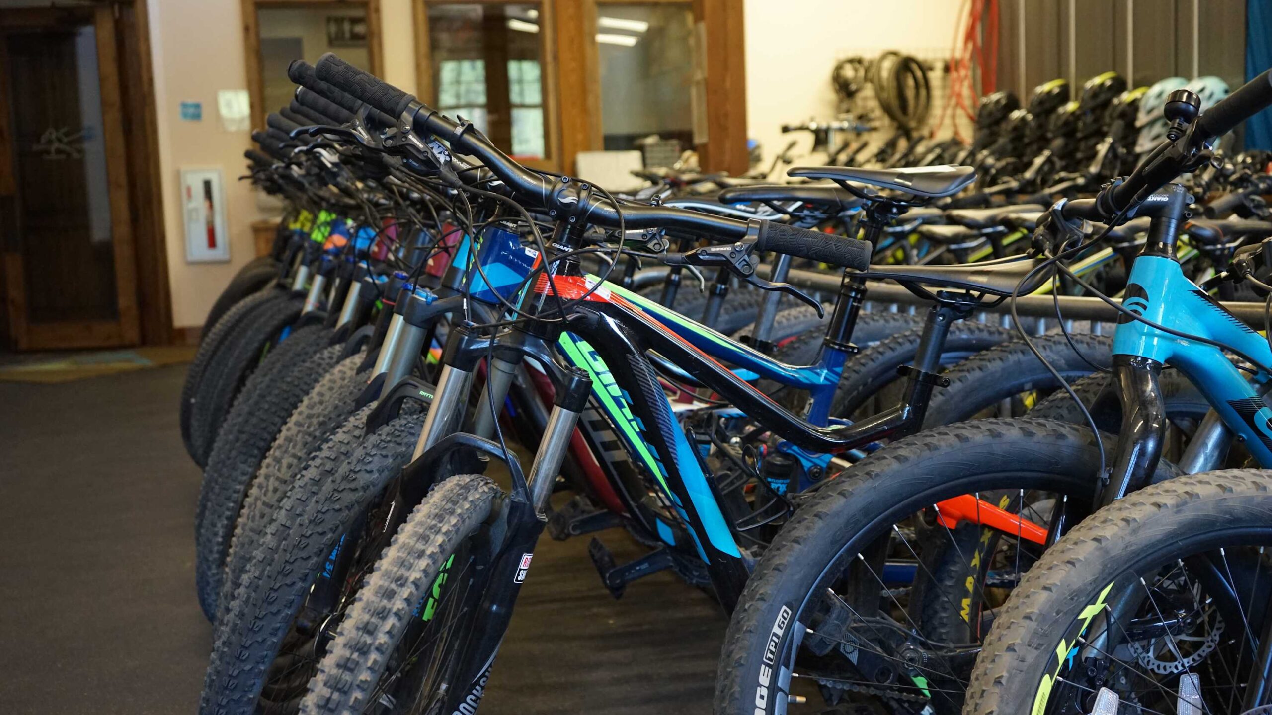 Rows of mountain bikes in a Truckee vacation rental, ready for adventure.