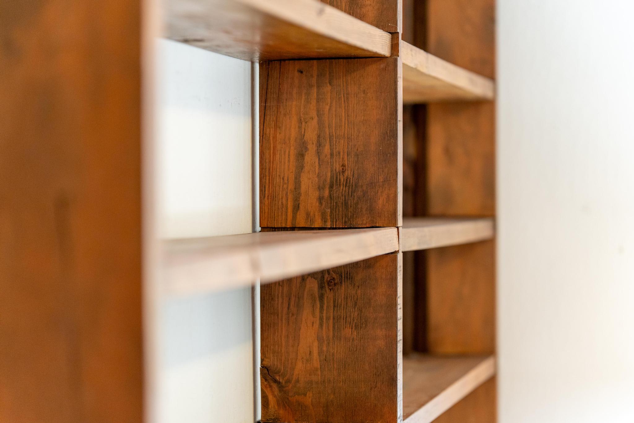 Wooden bookshelf in a Tahoe Vista vacation rental, showcasing a minimalist design and warm tones.