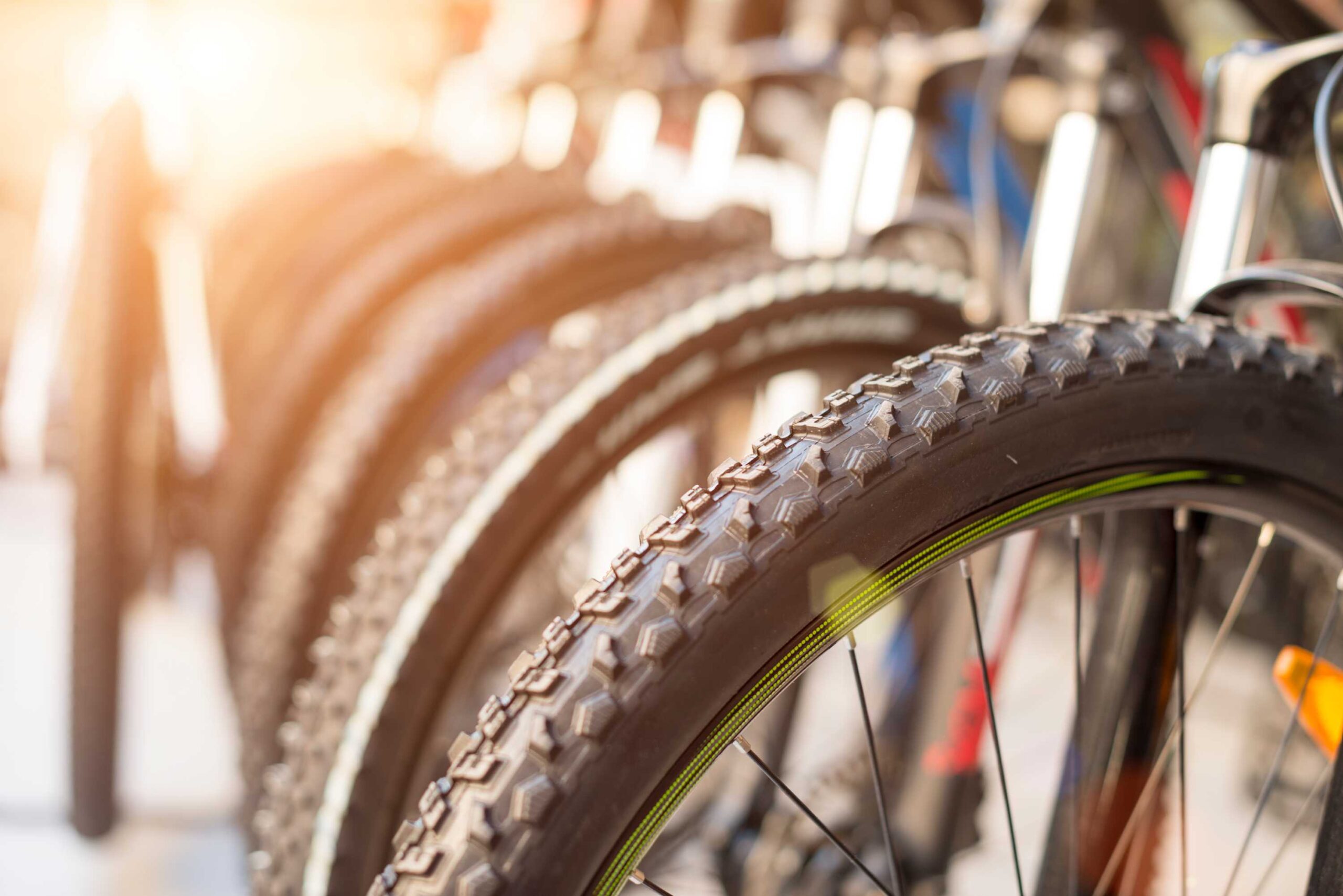 Close-up of bike tires at a vacation rental in Truckee, with sunlight highlighting the textured treads.