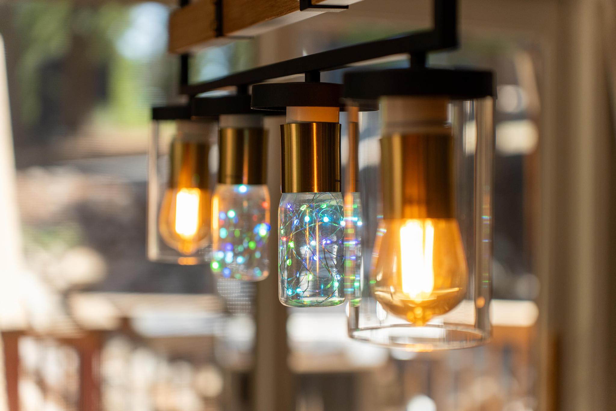 Modern pendant lights inside a Tahoe Vista vacation rental, featuring stylish glass bulbs and warm lighting.
