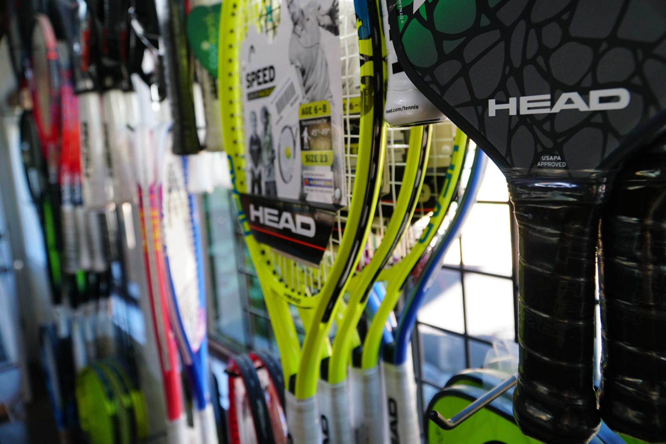Tennis and pickleball rackets on display in a Truckee vacation rental, ready for guests to enjoy sports activities.