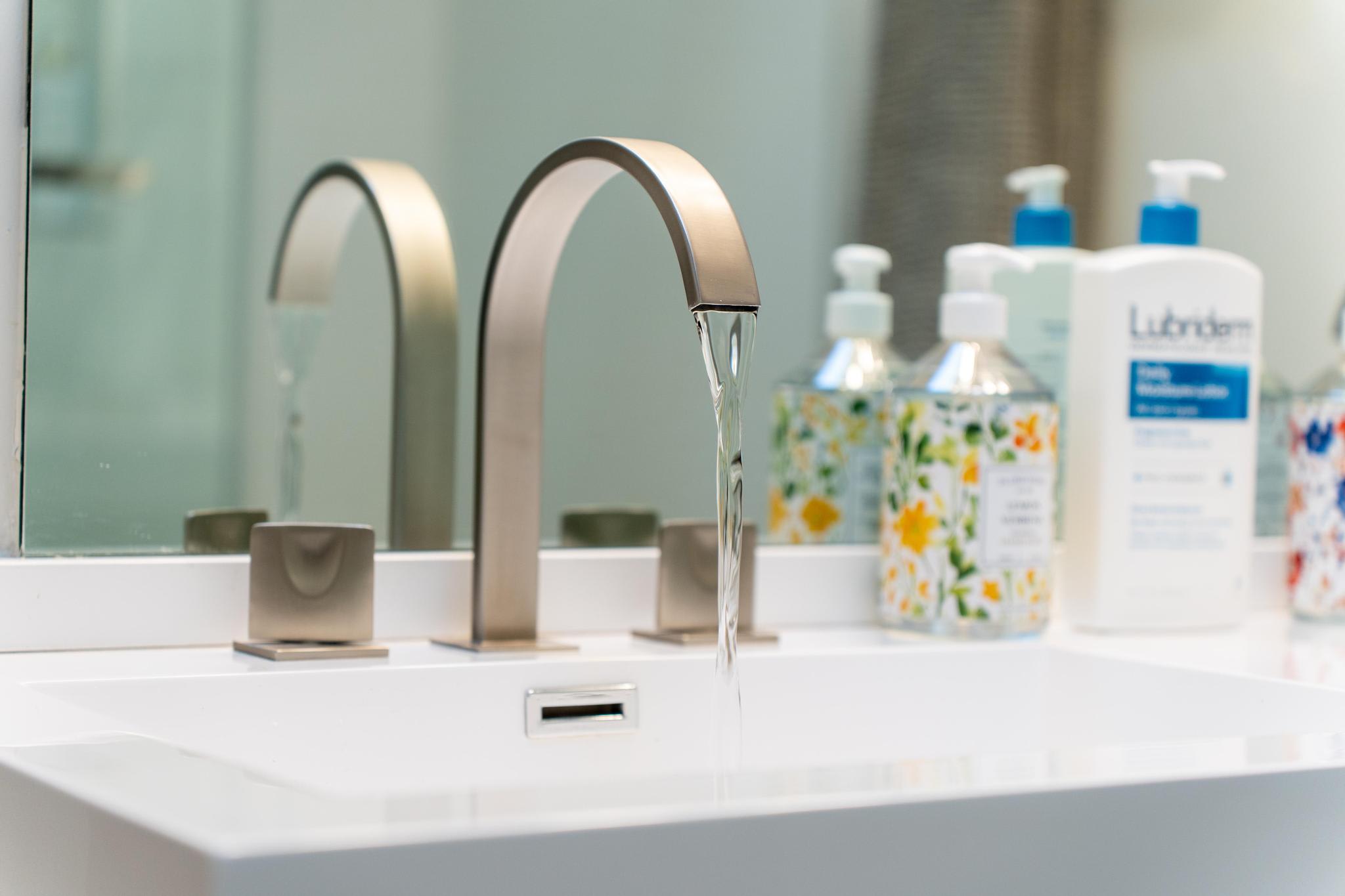 Modern faucet and toiletries in a Tahoe Vista vacation rental bathroom.