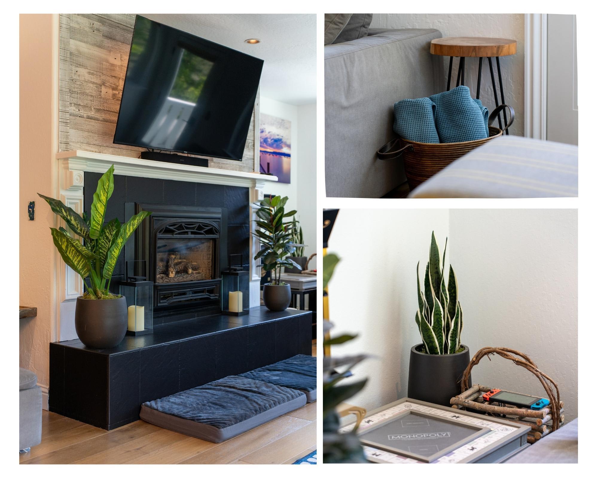 Cozy Truckee vacation rental with modern fireplace, plants, a basket of blankets, and board games for relaxation.
