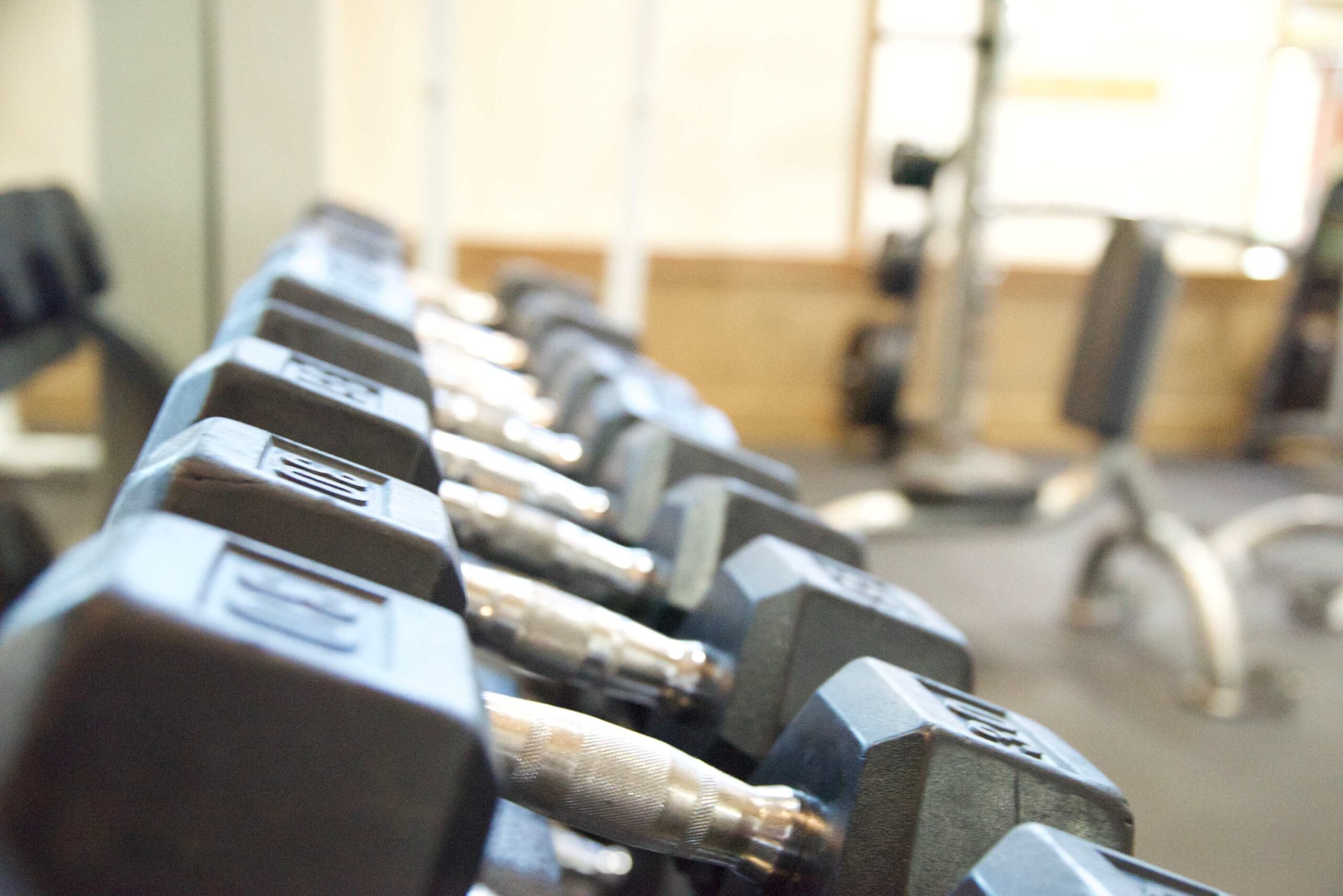 Row of dumbbells in a gym at a Truckee vacation rental, offering fitness facilities for guests.