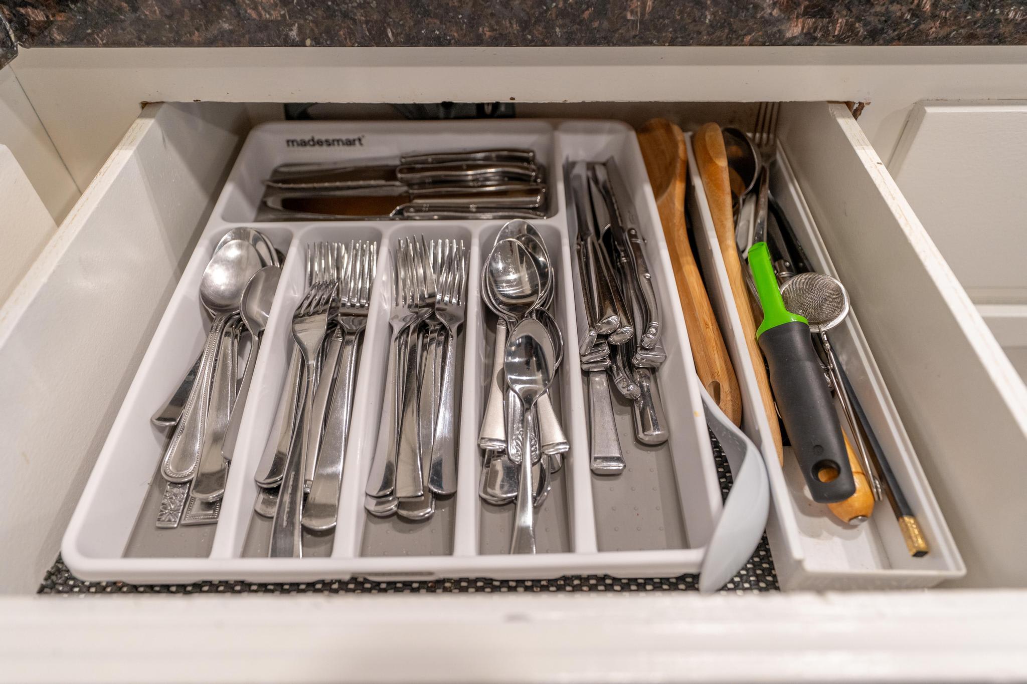 Open kitchen drawer with cutlery neatly organized in a Tahoe Vista vacation rental.