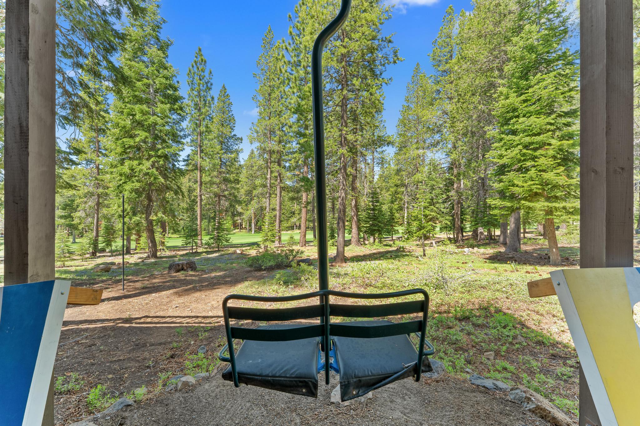 Rustic Truckee vacation rental with forest views, featuring a chairlift seat for a unique outdoor experience.