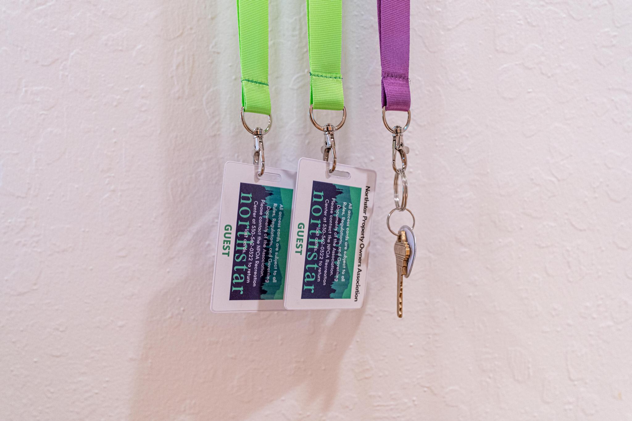 Guest passes and key on lanyards hanging in a Truckee vacation rental, offering easy access and convenience.