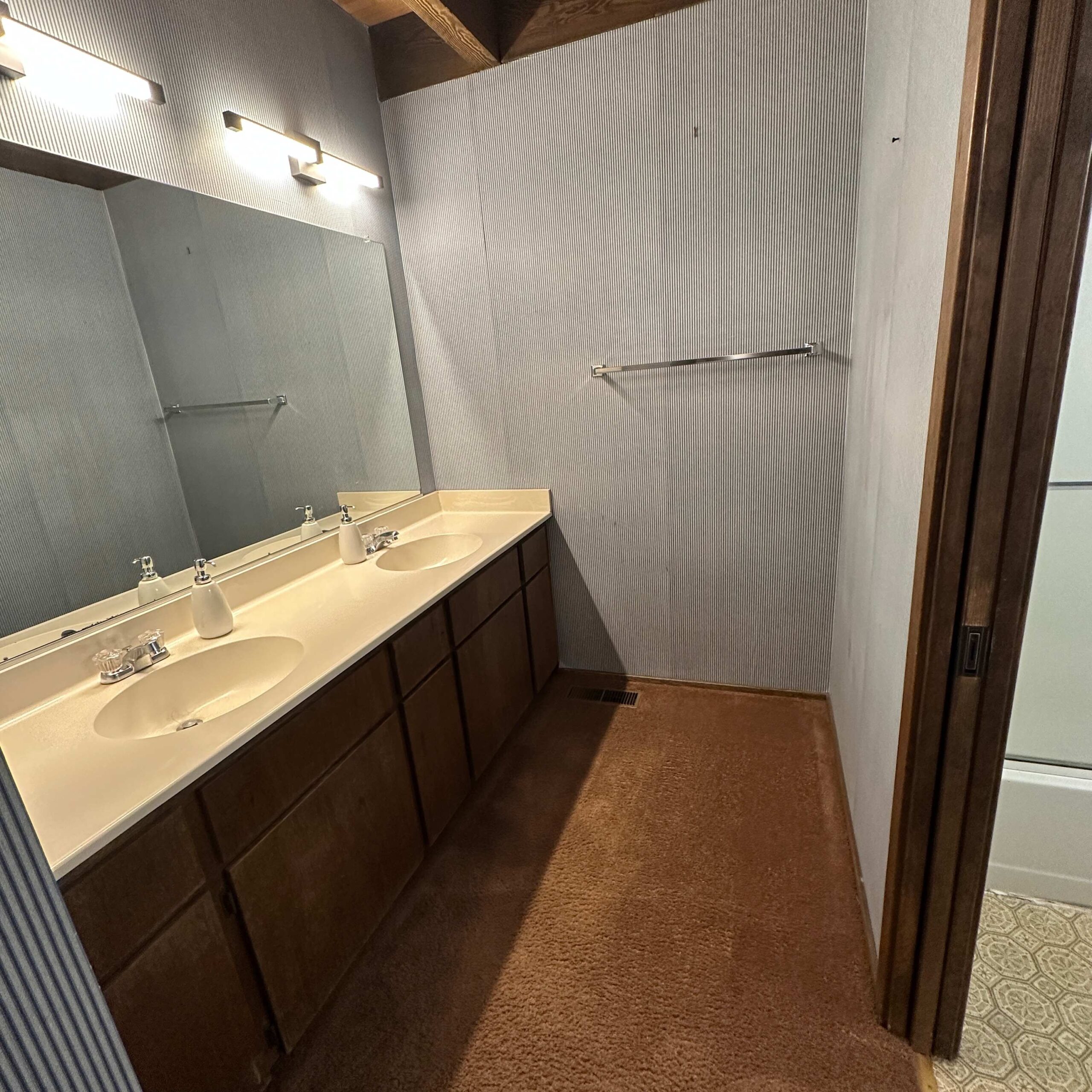 Bathroom in a Kings Beach vacation rental, featuring a double sink vanity and ample lighting.