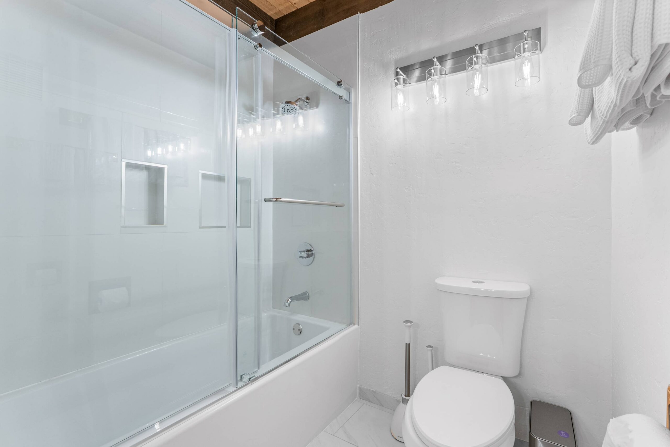 Modern bathroom with glass shower in a Kings Beach vacation rental.
