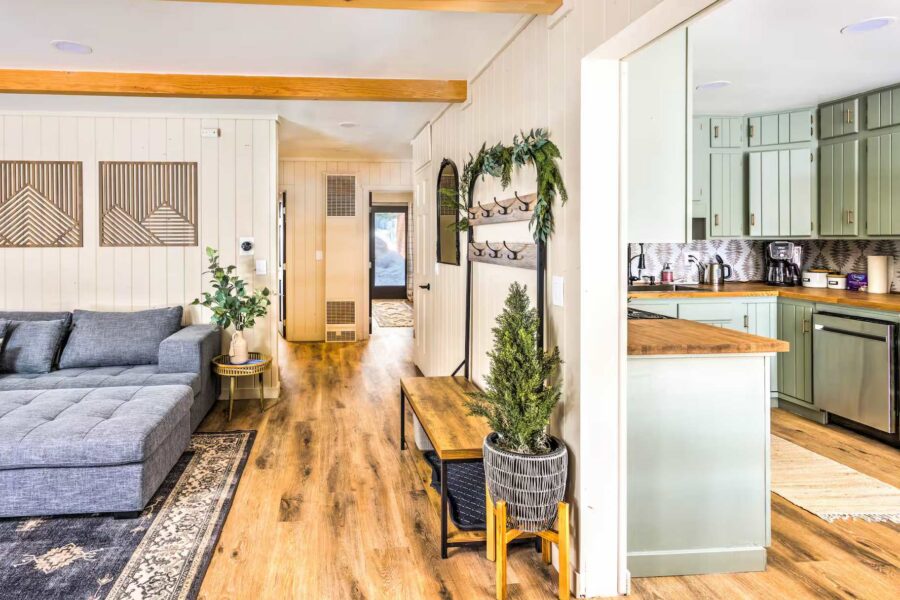 Cozy interior of a Kings Beach vacation rental with modern kitchen, wooden floors, and a stylish living area.