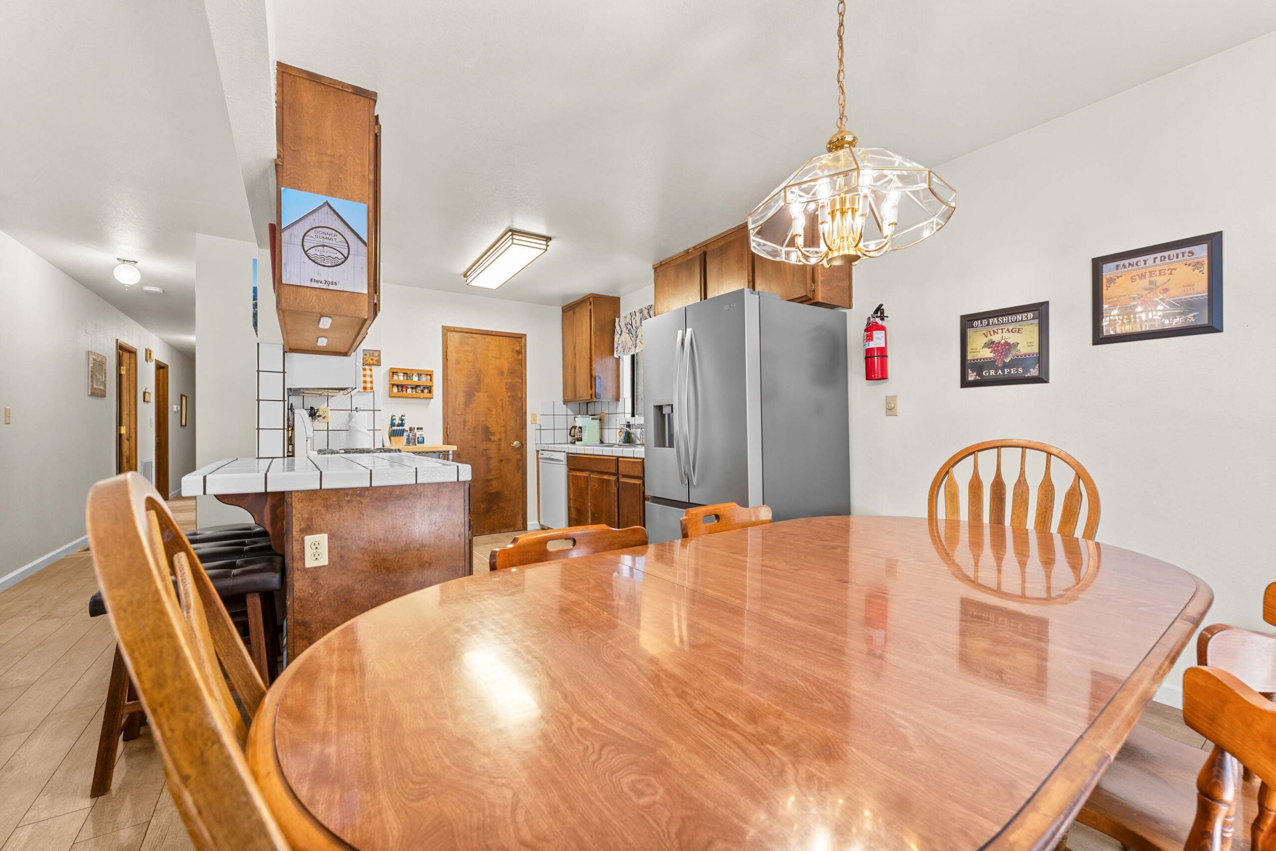 Cozy kitchen and dining area in a Truckee vacation rental with wooden furniture and modern appliances.