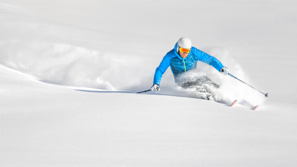person skiing in powder