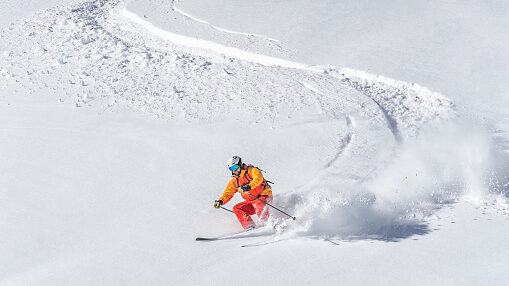 skier in fresh powder in truckee ca